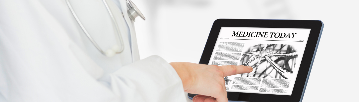 Doctor reading medicine today from digital tablet